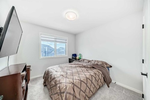 160 Lucas Common Nw, Calgary, AB - Indoor Photo Showing Bedroom