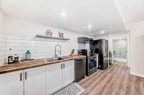 160 Lucas Common Nw, Calgary, AB - Indoor Photo Showing Kitchen With Double Sink With Upgraded Kitchen