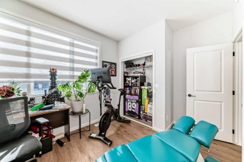 160 Lucas Common Nw, Calgary, AB - Indoor Photo Showing Gym Room