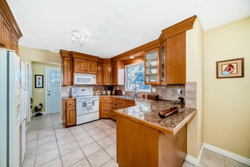 6007 Dalcastle Crescent Nw, Calgary, AB - Indoor Photo Showing Kitchen With Double Sink