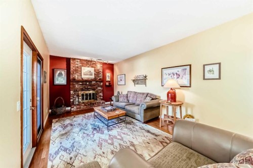 6007 Dalcastle Crescent Nw, Calgary, AB - Indoor Photo Showing Living Room With Fireplace