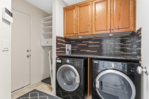 98 Cougarstone Close Sw, Calgary, AB - Indoor Photo Showing Laundry Room