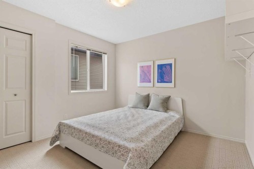 98 Cougarstone Close Sw, Calgary, AB - Indoor Photo Showing Bedroom