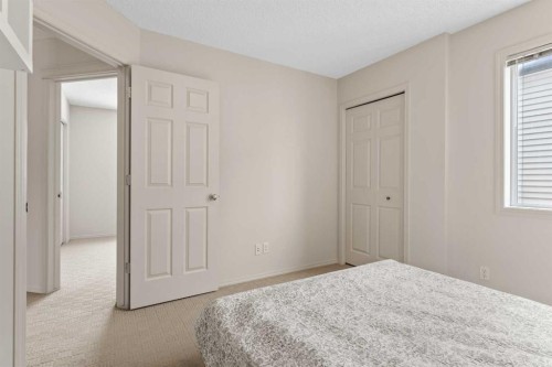 98 Cougarstone Close Sw, Calgary, AB - Indoor Photo Showing Bedroom