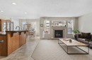 98 Cougarstone Close Sw, Calgary, AB  - Indoor Photo Showing Living Room With Fireplace 