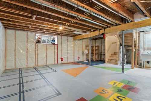 98 Cougarstone Close Sw, Calgary, AB - Indoor Photo Showing Basement