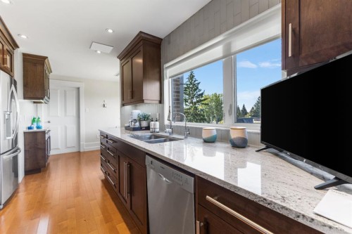 4N-222 Eagle Ridge Drive Sw, Calgary, AB - Indoor Photo Showing Kitchen With Stainless Steel Kitchen With Double Sink With Upgraded Kitchen