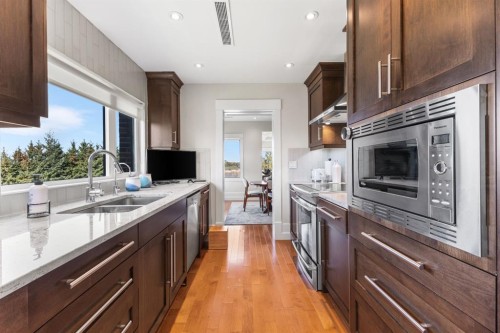 4N-222 Eagle Ridge Drive Sw, Calgary, AB - Indoor Photo Showing Kitchen With Double Sink