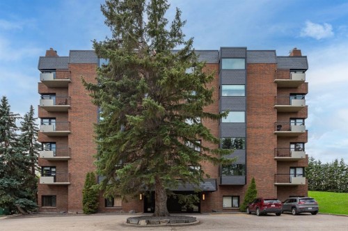 4N-222 Eagle Ridge Drive Sw, Calgary, AB - Outdoor With Balcony With Facade