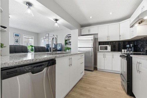 405 Windstone Grove Sw, Airdrie, AB - Indoor Photo Showing Kitchen With Stainless Steel Kitchen With Upgraded Kitchen