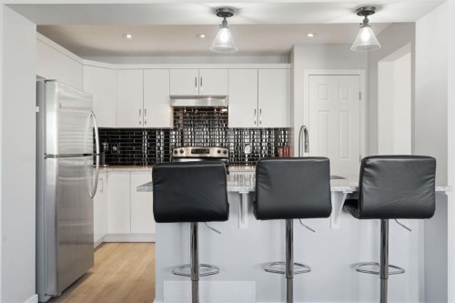 405 Windstone Grove Sw, Airdrie, AB - Indoor Photo Showing Kitchen With Upgraded Kitchen