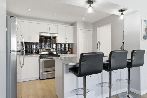 405 Windstone Grove Sw, Airdrie, AB - Indoor Photo Showing Kitchen With Stainless Steel Kitchen