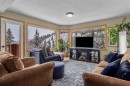 12-9 Blackrock Crescent West, Canmore, AB  - Indoor Photo Showing Living Room With Fireplace 