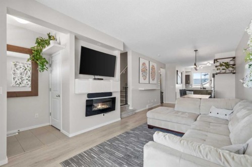 56 Legacy Main Street Se, Calgary, AB - Indoor Photo Showing Living Room With Fireplace