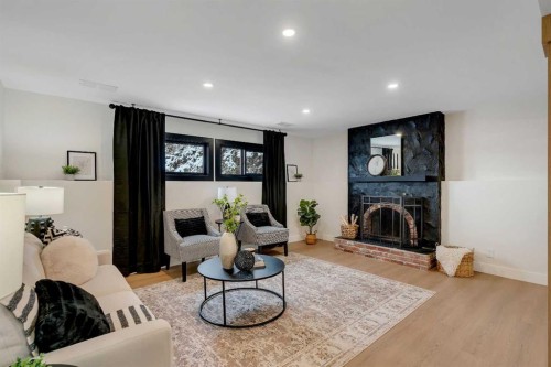 2416 Palliser Drive Sw, Calgary, AB - Indoor Photo Showing Living Room With Fireplace