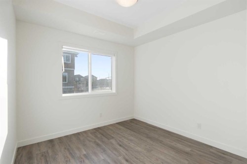 404-24 Rivercrest Drive, Cochrane, AB - Indoor Photo Showing Other Room