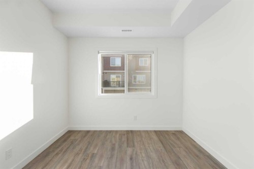 404-24 Rivercrest Drive, Cochrane, AB - Indoor Photo Showing Other Room