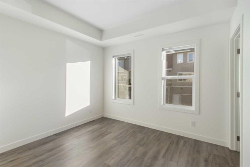 404-24 Rivercrest Drive, Cochrane, AB - Indoor Photo Showing Other Room