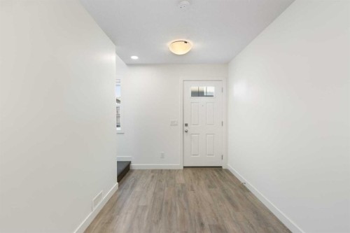 404-24 Rivercrest Drive, Cochrane, AB - Indoor Photo Showing Other Room