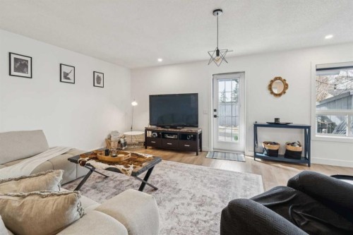 194 Martinglen Way Ne, Calgary, AB - Indoor Photo Showing Living Room With Fireplace