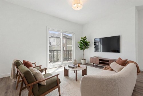 1701-24 Rivercrest Drive, Cochrane, AB - Indoor Photo Showing Living Room