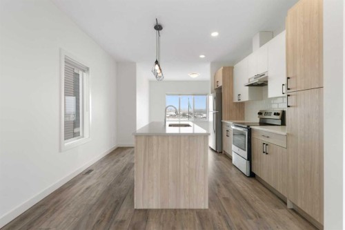 1701-24 Rivercrest Drive, Cochrane, AB - Indoor Photo Showing Kitchen With Upgraded Kitchen