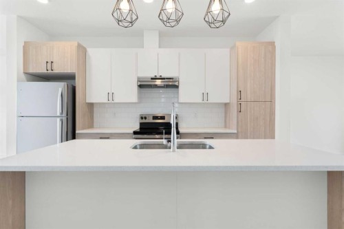 1701-24 Rivercrest Drive, Cochrane, AB - Indoor Photo Showing Kitchen With Double Sink With Upgraded Kitchen