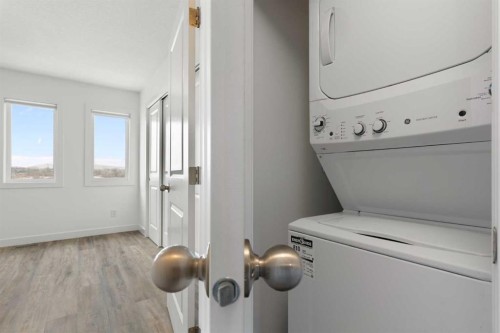 1701-24 Rivercrest Drive, Cochrane, AB - Indoor Photo Showing Laundry Room