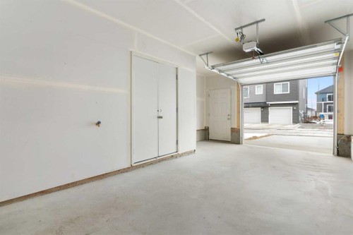 1701-24 Rivercrest Drive, Cochrane, AB - Indoor Photo Showing Garage