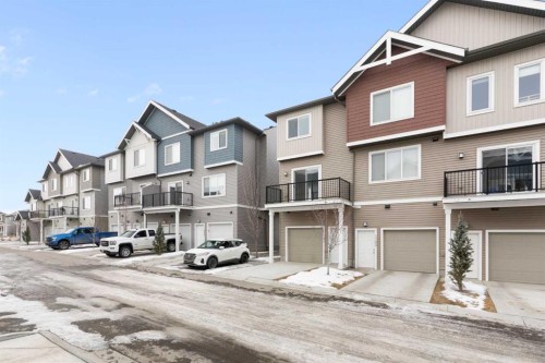 1701-24 Rivercrest Drive, Cochrane, AB - Outdoor With Facade