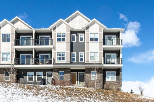 412-250 Fireside View, Cochrane, AB - Outdoor With Balcony With Facade