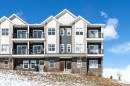 412-250 Fireside View, Cochrane, AB  - Outdoor With Balcony With Facade 