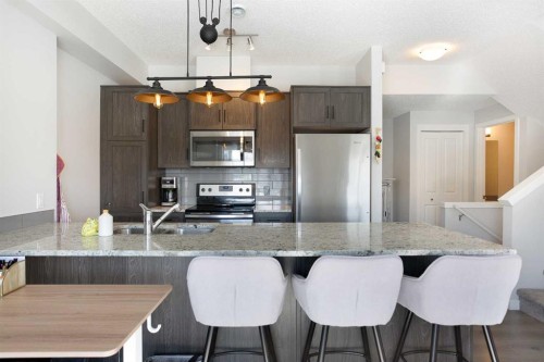 412-250 Fireside View, Cochrane, AB - Indoor Photo Showing Kitchen With Stainless Steel Kitchen With Double Sink With Upgraded Kitchen