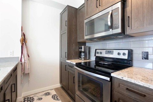 412-250 Fireside View, Cochrane, AB - Indoor Photo Showing Kitchen