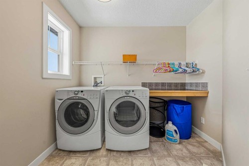 91 Bridlecrest Street Sw, Calgary, AB - Indoor Photo Showing Laundry Room