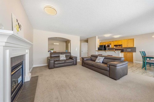 91 Bridlecrest Street Sw, Calgary, AB - Indoor Photo Showing Living Room With Fireplace