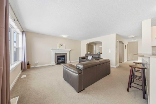 91 Bridlecrest Street Sw, Calgary, AB - Indoor Photo Showing Living Room With Fireplace