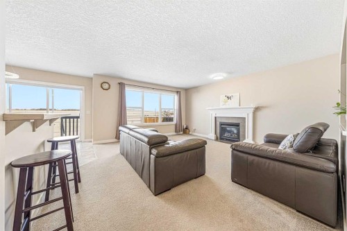 91 Bridlecrest Street Sw, Calgary, AB - Indoor Photo Showing Living Room With Fireplace