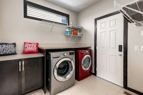 80 Auburn Springs Boulevard Se, Calgary, AB - Indoor Photo Showing Laundry Room