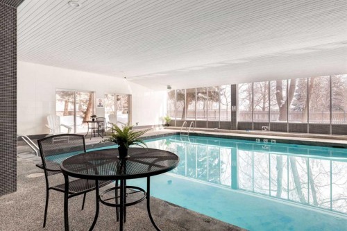 1114-4944 Dalton Drive Nw, Calgary, AB - Indoor Photo Showing Other Room With In Ground Pool