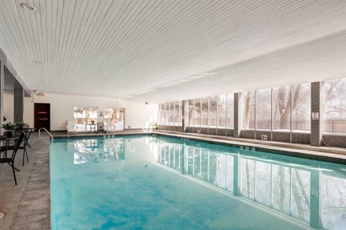 1114-4944 Dalton Drive Nw, Calgary, AB - Indoor Photo Showing Other Room With In Ground Pool