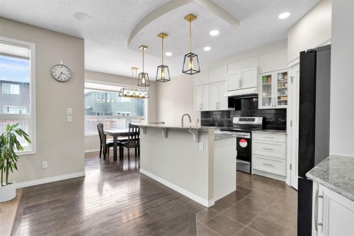 177 Cougar Ridge Close Sw, Calgary, AB - Indoor Photo Showing Kitchen With Upgraded Kitchen