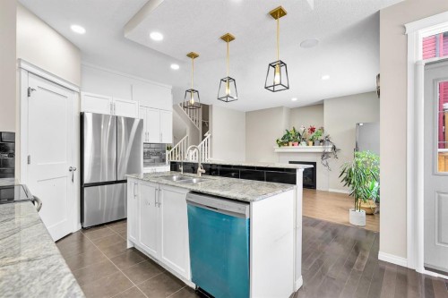 177 Cougar Ridge Close Sw, Calgary, AB - Indoor Photo Showing Kitchen With Stainless Steel Kitchen With Double Sink With Upgraded Kitchen