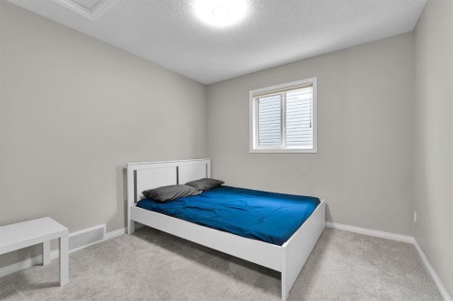 177 Cougar Ridge Close Sw, Calgary, AB - Indoor Photo Showing Bedroom