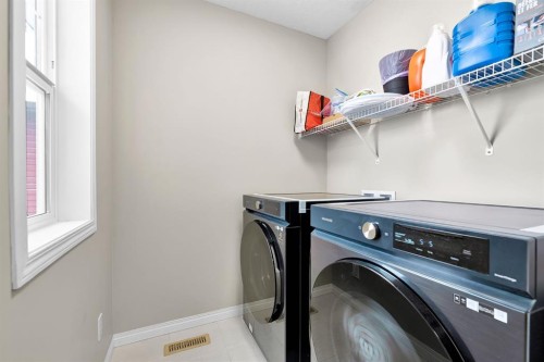 177 Cougar Ridge Close Sw, Calgary, AB - Indoor Photo Showing Laundry Room