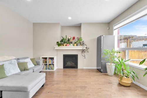 177 Cougar Ridge Close Sw, Calgary, AB - Indoor Photo Showing Living Room With Fireplace