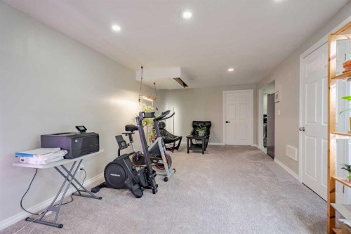 4803 Brockington Road Nw, Calgary, AB - Indoor Photo Showing Gym Room