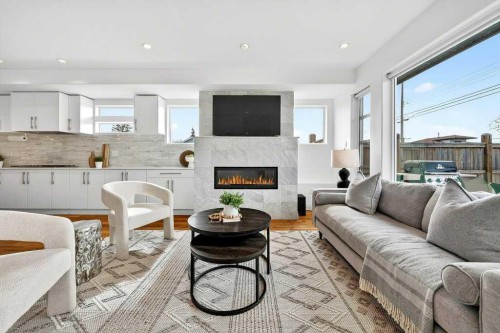 4504 37 Avenue Sw, Calgary, AB - Indoor Photo Showing Living Room With Fireplace