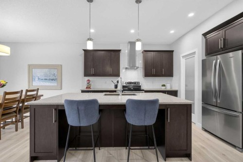 218 Riviera View, Cochrane, AB - Indoor Photo Showing Kitchen With Stainless Steel Kitchen With Upgraded Kitchen