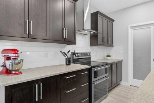 218 Riviera View, Cochrane, AB - Indoor Photo Showing Kitchen With Upgraded Kitchen